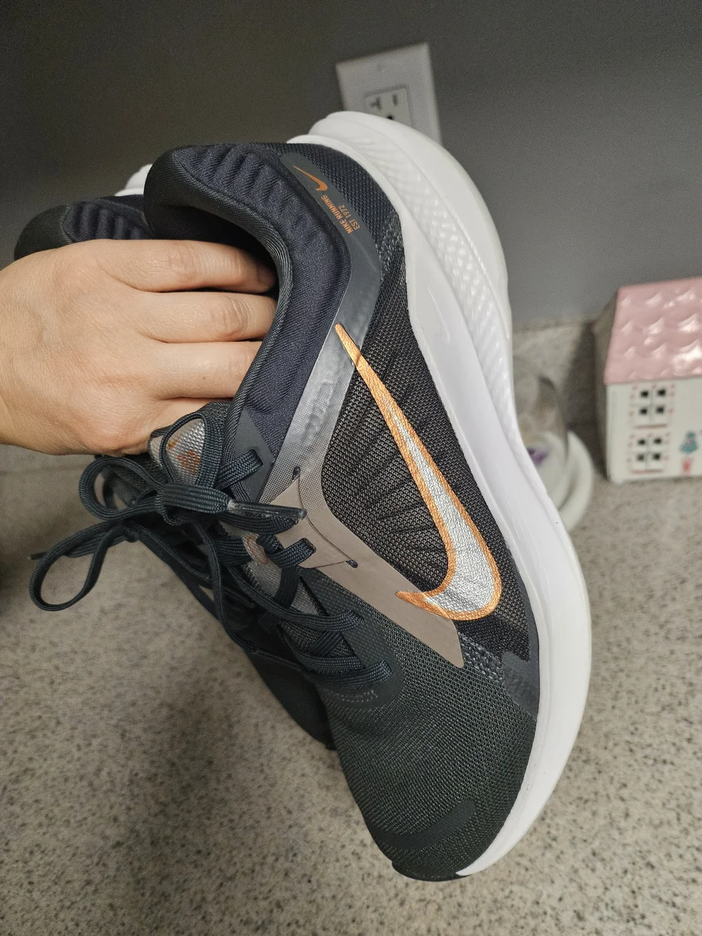 Nike Women's Black Running Shoes with Metallic Orange Swoosh